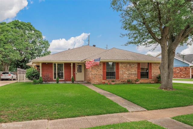 5601 Bayou Dr, Bossier City, LA 71112 - ranch-style home with fence, a front yard, driveway, and brick siding