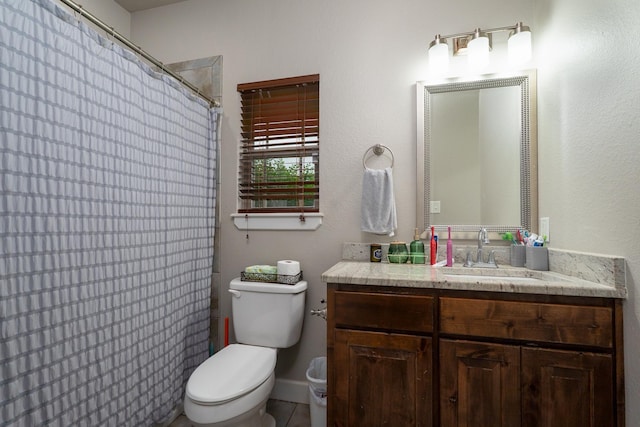 bathroom with vanity, toilet, and a shower with shower curtain
