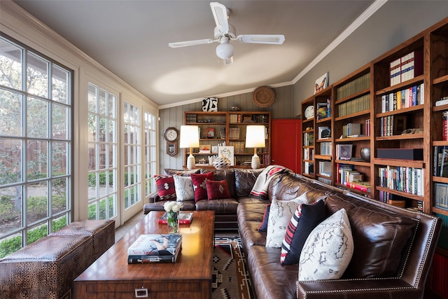 4310 Rawlins St, Dallas, TX 75219 - living area with ornamental molding, a ceiling fan, wooden walls, and vaulted ceiling