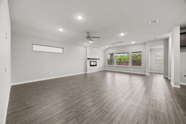 unfurnished living room featuring visible vents, ceiling fan, baseboards, recessed lighting, and dark wood-type flooring