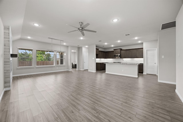 unfurnished living room featuring ceiling fan, recessed lighting, visible vents, and baseboards