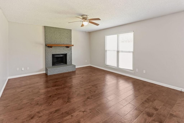 4109 Orchard Hill Dr, Arlington, TX 76016 - unfurnished living room with a textured ceiling, ceiling fan, dark wood finished floors, and baseboards