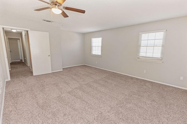 4109 Orchard Hill Dr, Arlington, TX 76016 - carpeted spare room with baseboards, visible vents, ceiling fan, and a textured ceiling