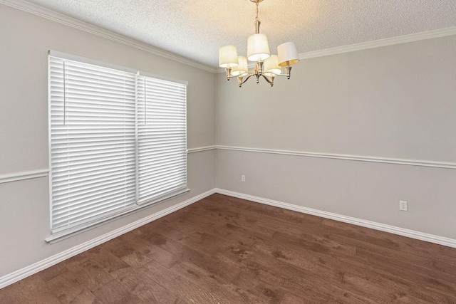 4109 Orchard Hill Dr, Arlington, TX 76016 - empty room featuring an inviting chandelier, crown molding, baseboards, a textured ceiling, and wood finished floors