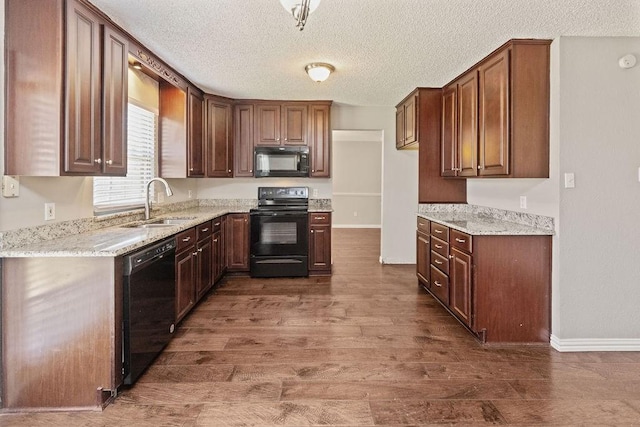 4109 Orchard Hill Dr, Arlington, TX 76016 - kitchen with black appliances, a textured ceiling, a sink, and dark wood finished floors