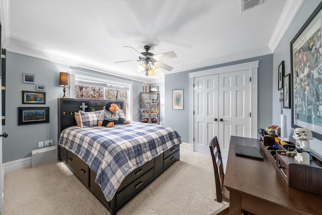 bedroom with light colored carpet, a closet, baseboards, visible vents, and crown molding