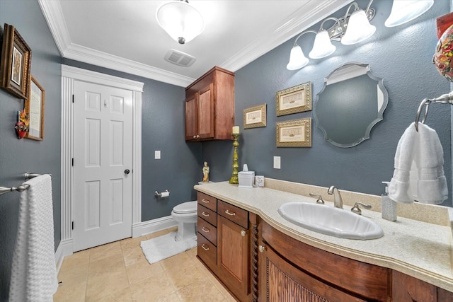 bathroom featuring ornamental molding, toilet, vanity, baseboards, and visible vents