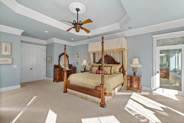 bedroom with crown molding, visible vents, and carpet