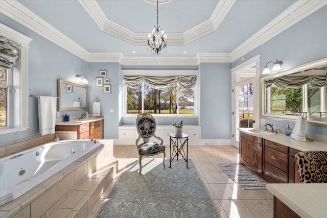 full bath with a raised ceiling, a chandelier, a whirlpool tub, tile patterned floors, and vanity