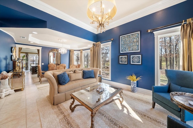 tiled living area featuring a chandelier, a raised ceiling, visible vents, baseboards, and ornamental molding