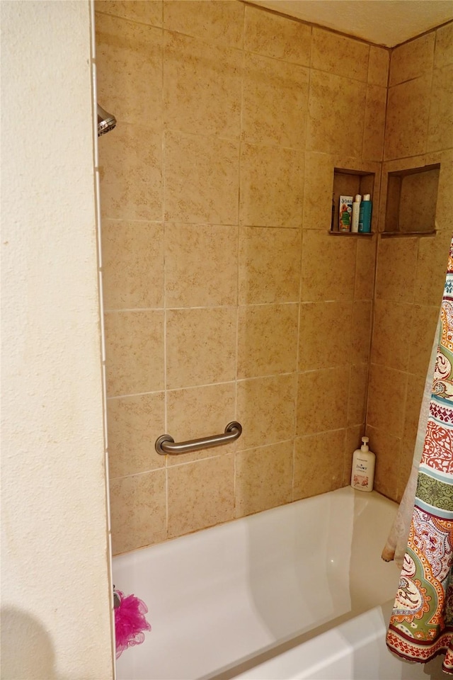 full bathroom with a bathing tub and curtained shower