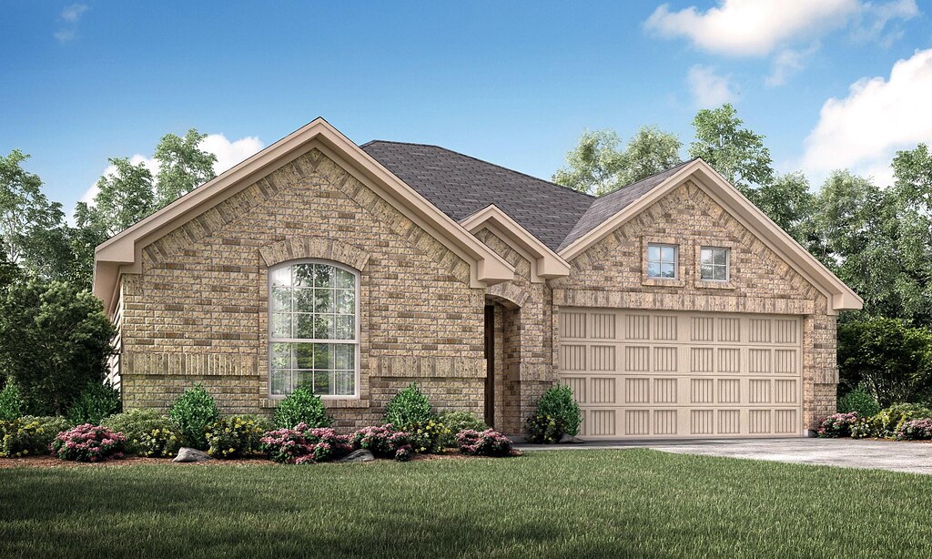 french country inspired facade featuring concrete driveway, a front yard, brick siding, and a garage