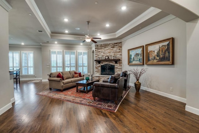 1415 Aberdeen Dr, Lucas, TX 75002 - living area with arched walkways, a ceiling fan, wood finished floors, a tray ceiling, and ornamental molding