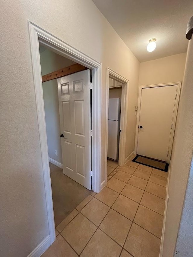 104 Misty Glen Ln, Murphy, TX 75094 - hallway with light tile patterned floors and baseboards