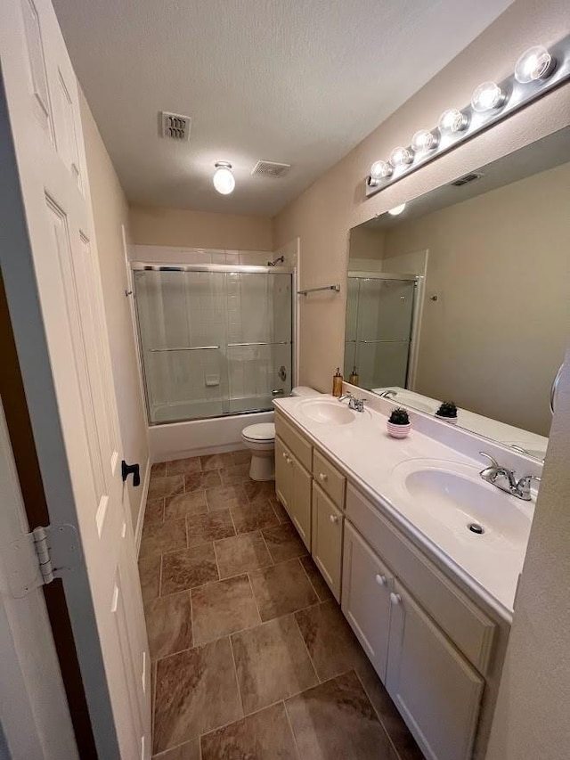 104 Misty Glen Ln, Murphy, TX 75094 - bathroom with toilet, double vanity, a sink, and visible vents