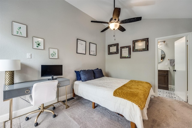 carpeted bedroom featuring connected bathroom, a ceiling fan, vaulted ceiling, and baseboards