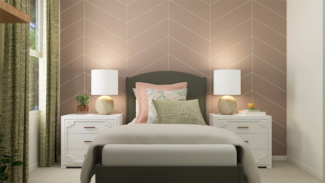 bedroom featuring light colored carpet and baseboards