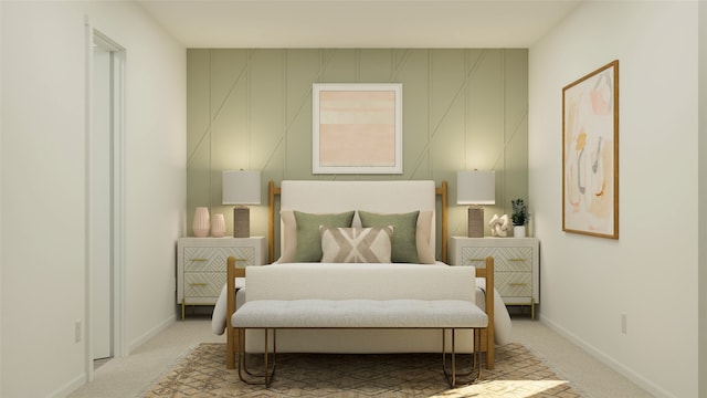 bedroom with baseboards and light colored carpet