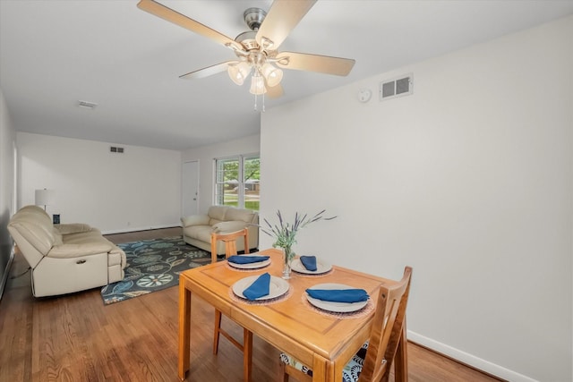 1207 W Tucker Blvd, Arlington, TX 76013 - dining area featuring light wood-style floors, baseboards, ceiling fan, and visible vents
