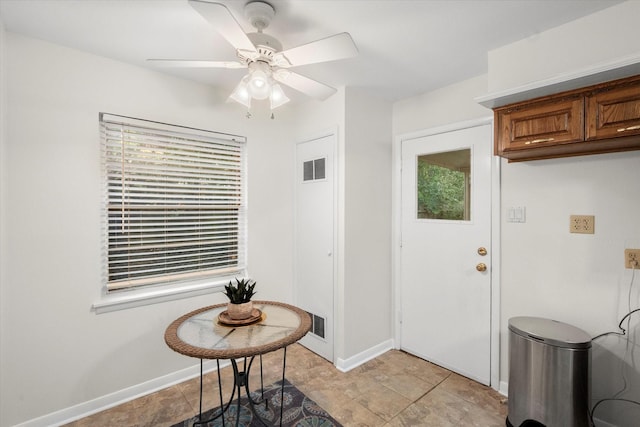 1207 W Tucker Blvd, Arlington, TX 76013 - foyer with baseboards, ceiling fan, visible vents, and a wealth of natural light