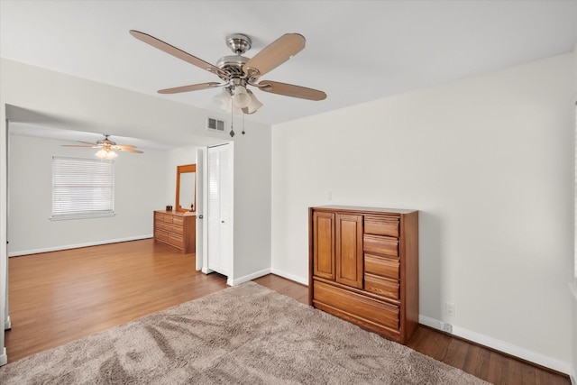 1207 W Tucker Blvd, Arlington, TX 76013 - spare room featuring baseboards, ceiling fan, wood finished floors, and visible vents