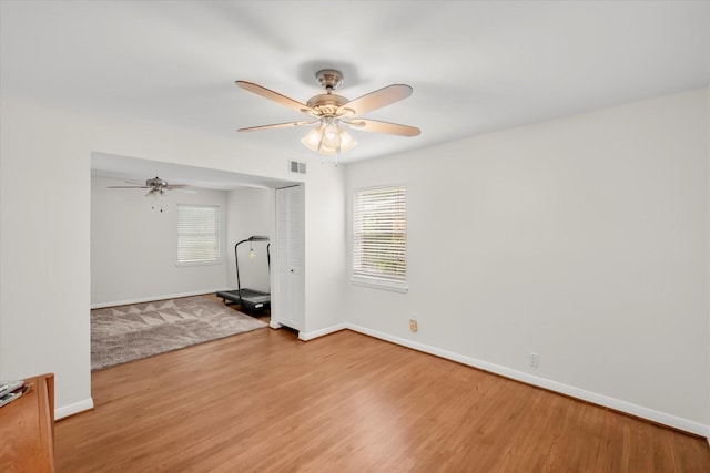1207 W Tucker Blvd, Arlington, TX 76013 - unfurnished room with baseboards, ceiling fan, wood finished floors, and visible vents