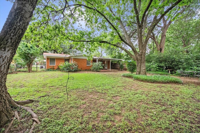 1207 W Tucker Blvd, Arlington, TX 76013 - view of yard featuring fence and a carport