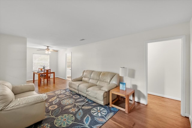 1207 W Tucker Blvd, Arlington, TX 76013 - living area with baseboards, a ceiling fan, wood finished floors, and visible vents