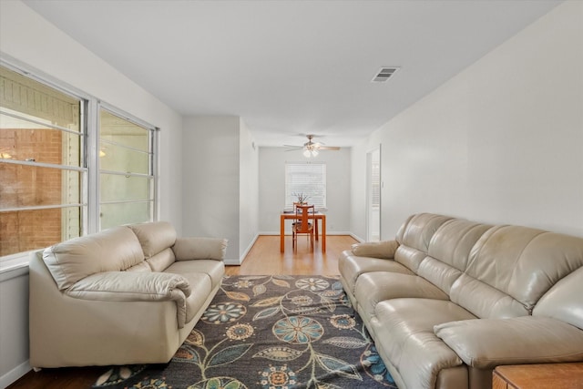 1207 W Tucker Blvd, Arlington, TX 76013 - living room with visible vents, baseboards, and wood finished floors