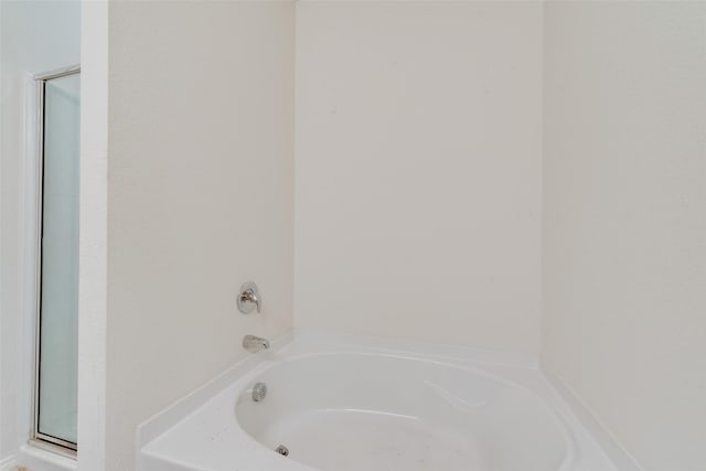 1015 Norias Dr, Forney, TX 75126 - bathroom with a bath and a stall shower