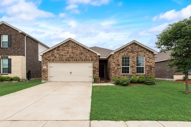 1015 Norias Dr, Forney, TX 75126 - view of front of property with an attached garage, concrete driveway, a front yard, and brick siding