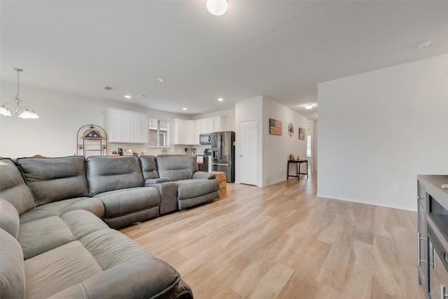 1015 Norias Dr, Forney, TX 75126 - living area featuring a chandelier, light wood-type flooring, and recessed lighting