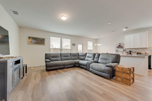 1015 Norias Dr, Forney, TX 75126 - living area with light wood-style floors, a chandelier, and recessed lighting