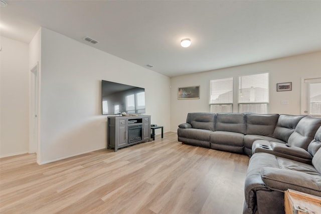 1015 Norias Dr, Forney, TX 75126 - living room with light wood-style flooring, plenty of natural light, and baseboards