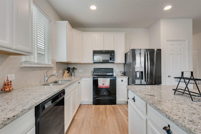 1015 Norias Dr, Forney, TX 75126 - kitchen with black appliances, a sink, white cabinets, light stone countertops, and recessed lighting