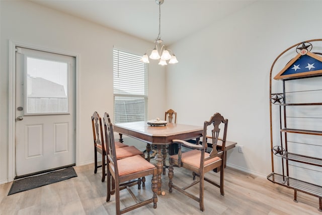 1015 Norias Dr, Forney, TX 75126 - dining room with a chandelier, light wood-style floors, and baseboards