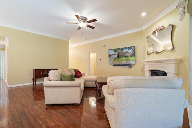 living room featuring a fireplace, ceiling fan, dark wood-type flooring, crown molding, and baseboards
