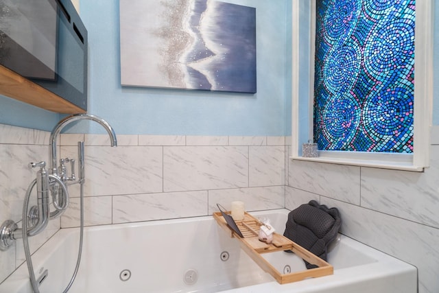 bathroom with a whirlpool tub