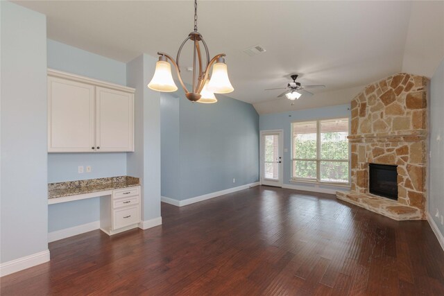3017 Bella Lago Dr, Denton, TX 76210 - unfurnished living room with built in study area, ceiling fan, vaulted ceiling, and visible vents