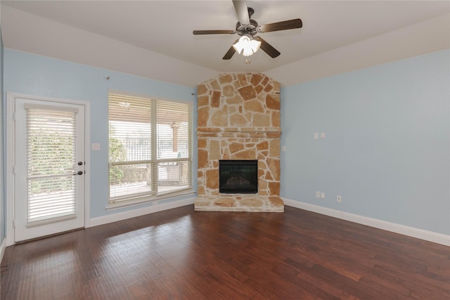 3017 Bella Lago Dr, Denton, TX 76210 - unfurnished living room with lofted ceiling, wood finished floors, baseboards, a stone fireplace, and a ceiling fan