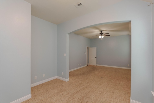 3017 Bella Lago Dr, Denton, TX 76210 - unfurnished room featuring arched walkways, ceiling fan, light carpet, and visible vents