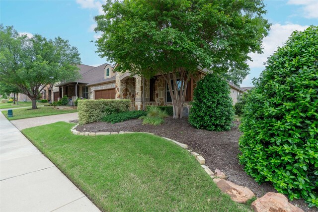 3017 Bella Lago Dr, Denton, TX 76210 - exterior space with a front yard, an attached garage, and stone siding