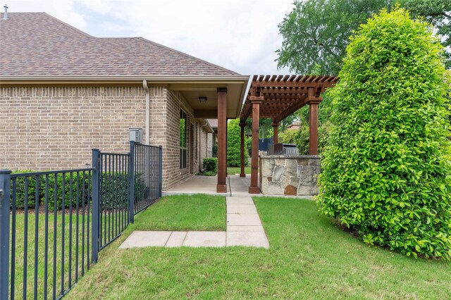 3017 Bella Lago Dr, Denton, TX 76210 - exterior space featuring a lawn, brick siding, fence, an outdoor kitchen, and a pergola