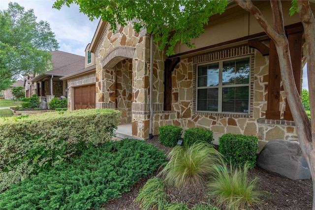3017 Bella Lago Dr, Denton, TX 76210 - entrance to property with a garage and stone siding