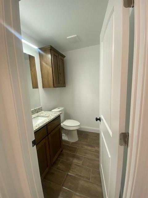 1716 Oldham Ln, Abilene, TX 79602 - half bath featuring toilet and vanity