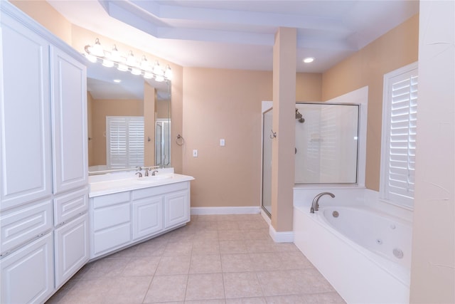 full bathroom with tile patterned flooring, vanity, baseboards, a tub with jets, and a stall shower
