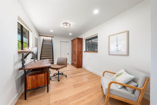 office featuring light wood finished floors, recessed lighting, and baseboards