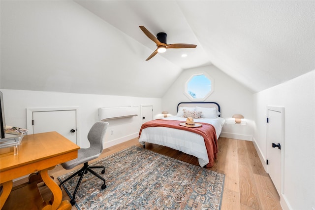 bedroom with lofted ceiling, ceiling fan, light wood finished floors, and baseboards