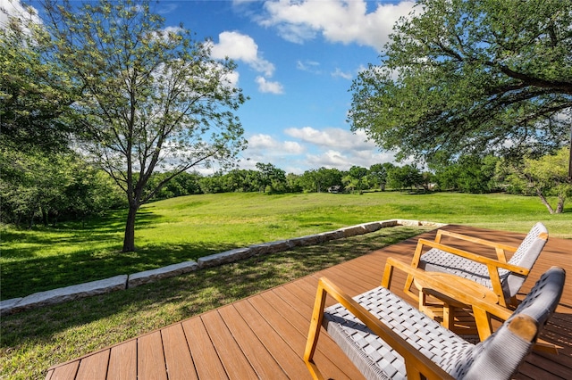 wooden deck with a lawn