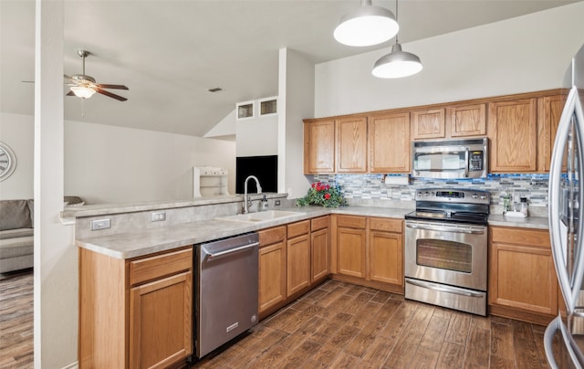 kitchen featuring a sink, appliances with stainless steel finishes, and light countertops
